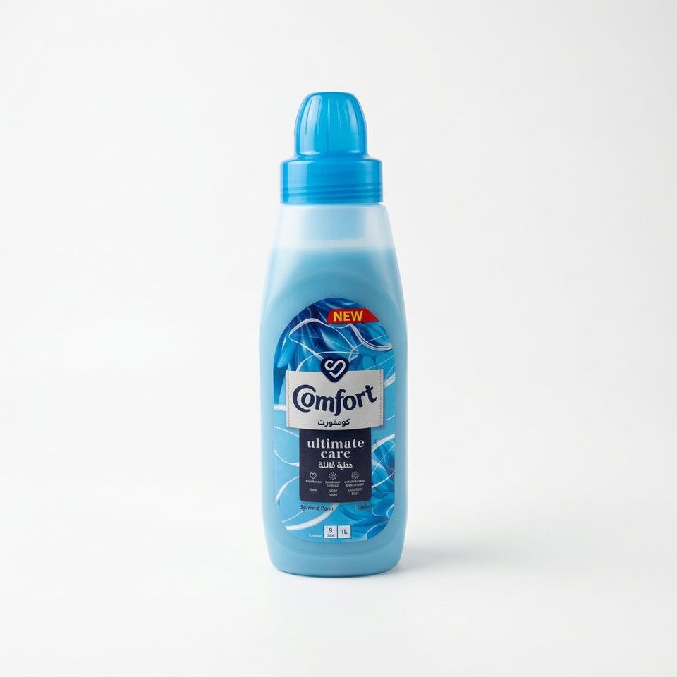 A blue bottle of Comfort Ultimate Care Spring Dew fabric softener.